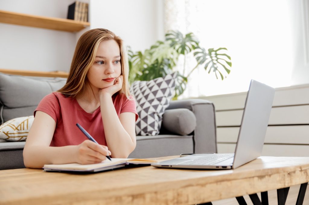 girl studies online at home
