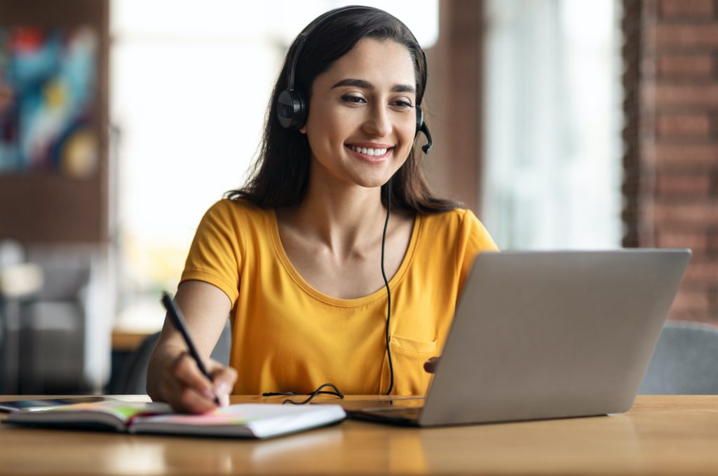 Happy young arab woman having educational course online