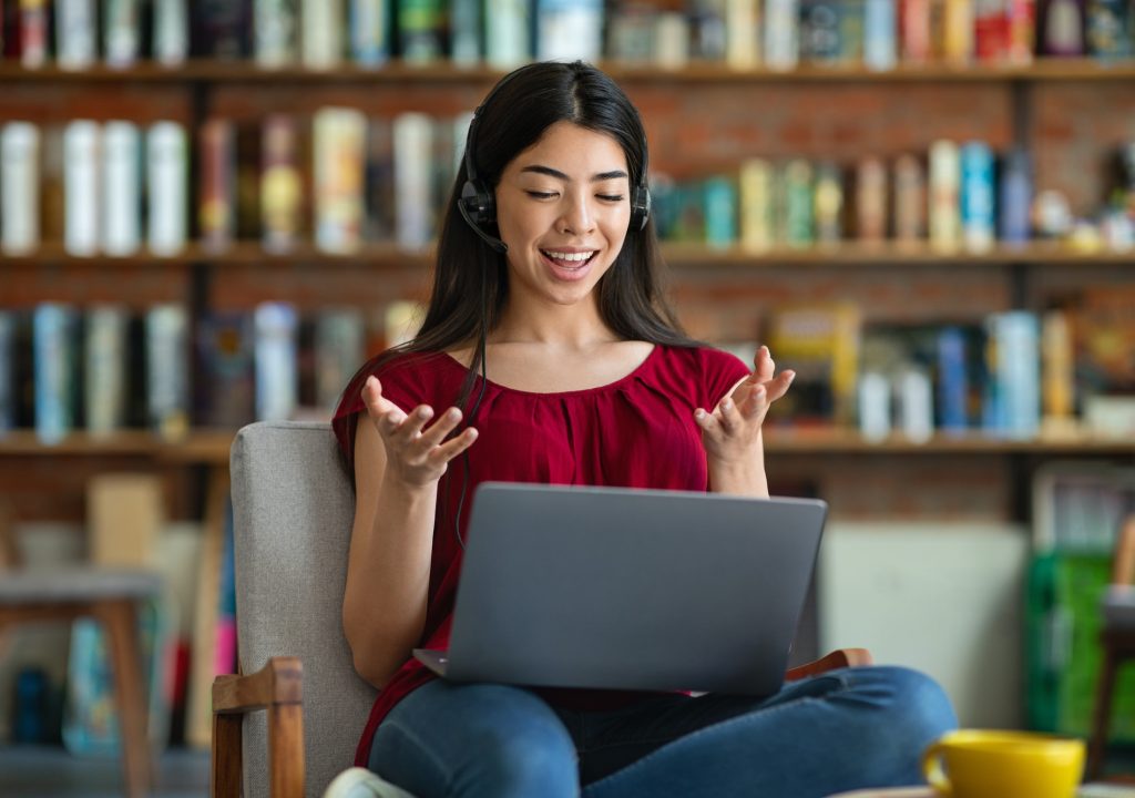Online Tutoring. Young Asian Female Tutor Teaching Foreign Language Via Video Conference